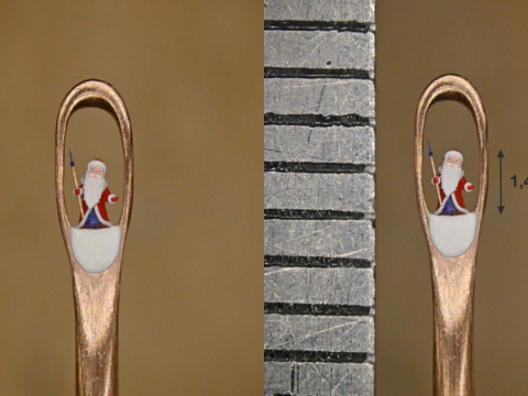 Новосибирский мастер микроминиатюры создал Деда Мороза, помещающегося в игольном ушке